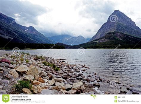 Clear Lake And High Mountains In Glacier National Park
