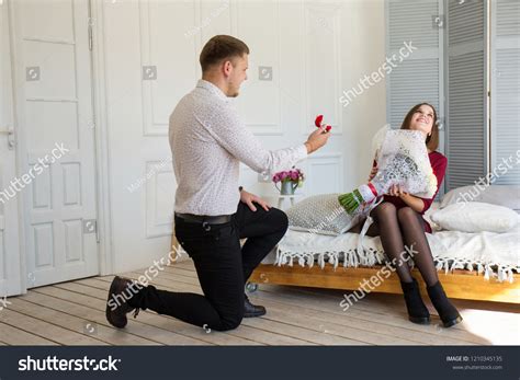 Young Man Makes Proposal His Girlfriend Stock Photo 1210345135