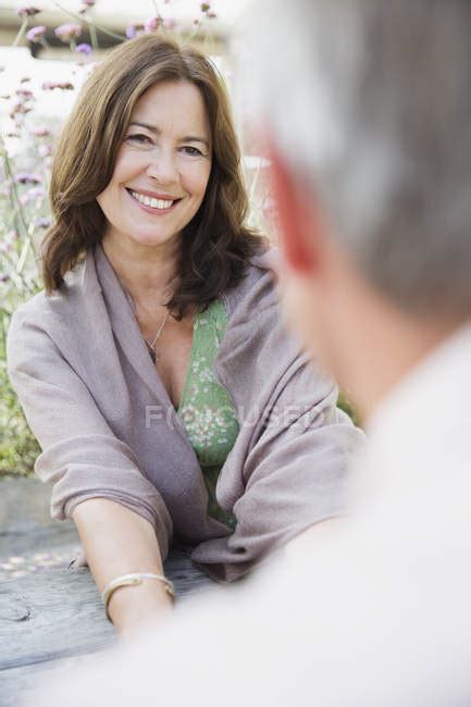 Mature Woman Smiling At Man — Caucasian Mature Adult Stock Photo