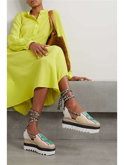STELLA MCCARTNEY + NET SUSTAIN Gaia embroidered striped raffia flatform