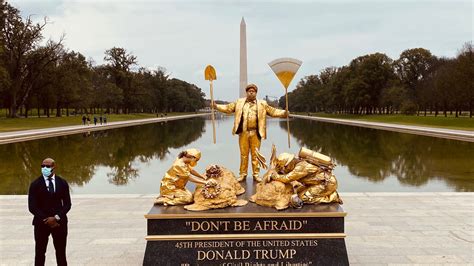 living statues mock the president in front of lincoln memorial and trump hotel npr