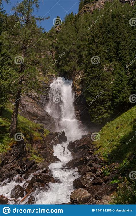 Beautiful Waterfall In A Wood On The Italian Dolomites Stock Photo