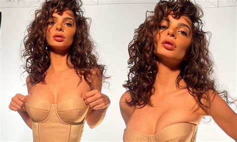 Emily Ratajkowski Puts On Busty Display In Nude Corset And Curly Hair