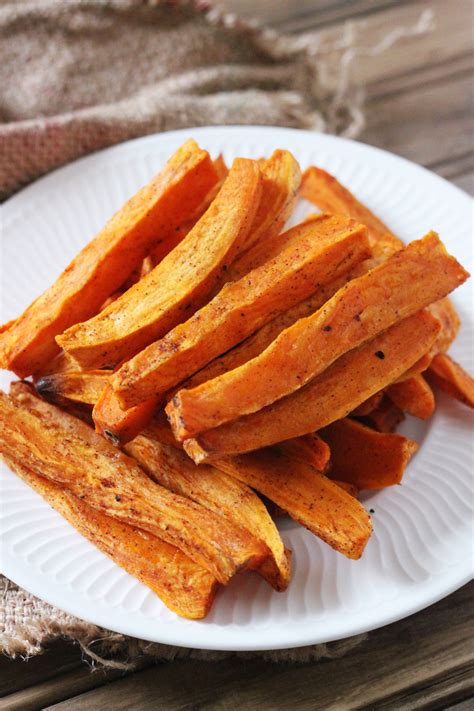 Halve the sweet potatoes lengthwise and cut each half into 3 long spears. Baked Crispy Sweet Potato Fries - The Tasty Bite