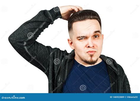 Thinking Man Holds Hand At Face Isolated On White Background Closeup