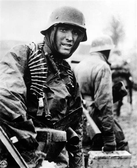 German Machine Gunner Marching Through The Ardennes In The Battle Of