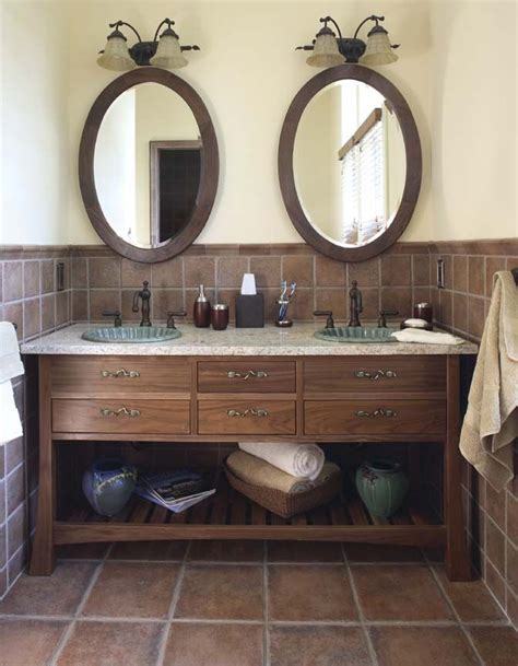 A double walnut vanity is topped with a clean white countertop in this chic bathroom. Hand Made Custom Bathroom Vanity by Hardwood Artisans ...