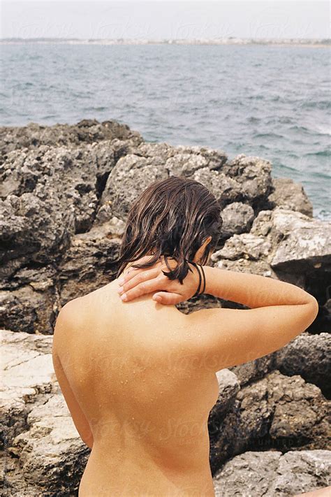 Topless Woman On The Seaside By Stocksy Contributor Lucas Ottone