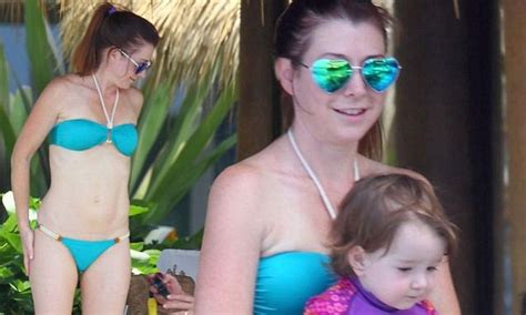 Alyson Hannigan Wears Heart Shaped Sunglasses With Matching Turquoise