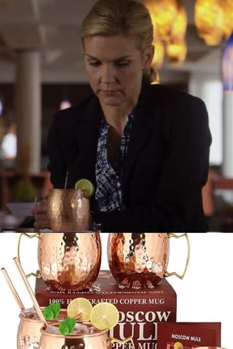 The Woman Is Pouring Her Drink Into Copper Mugs With Lemon Wedges On Top