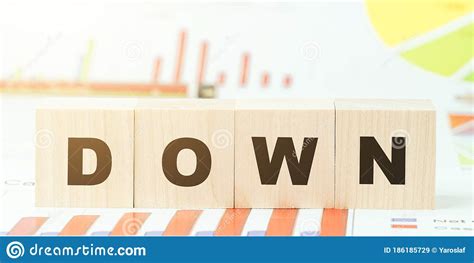 Word Down Made With Black Letters On Wooden Blocks On Desk Stock Image