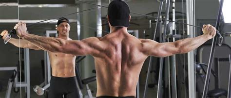 man doing rear delt exercise the reverse cable fly