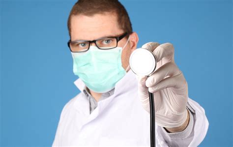 Doctor With Stethoscope On Blue Background Creative Commons Bilder