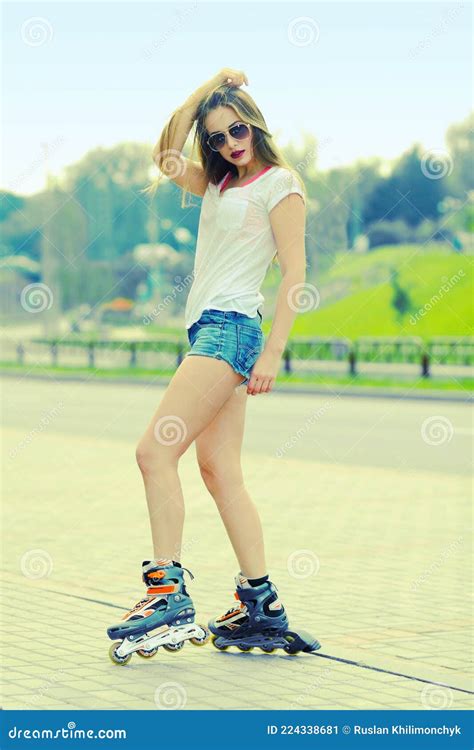 beautiful girl posing on the road in roller skates stock image image of happy lady 224338681