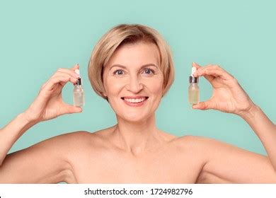 Naked Beautiful Blonde Mature Woman Standing Stock Photo