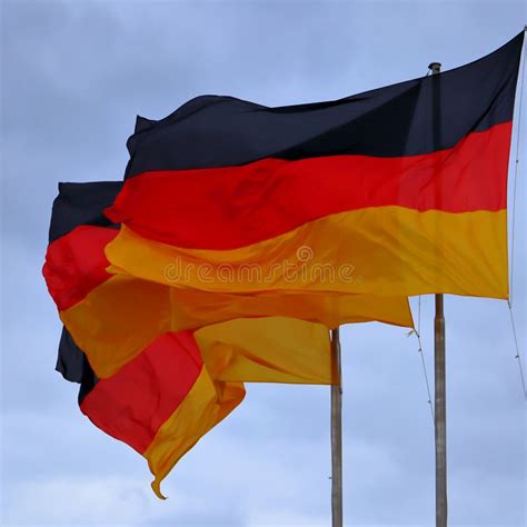 Three Flags Of Germany German Flag Blowing In The Wind Stock Photo