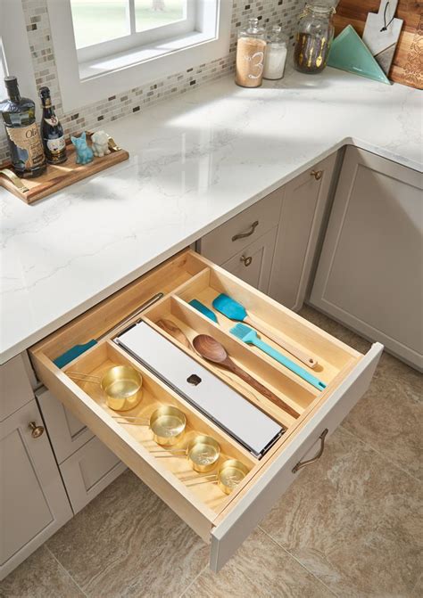 Learn how to use inexpensive hooks to install foil and saran wrap on the inside of your kitchen cabinets for easy access. 4WUT Utensil and Foil Organizer | Wood utensils, Wood cutlery, Kitchen storage solutions