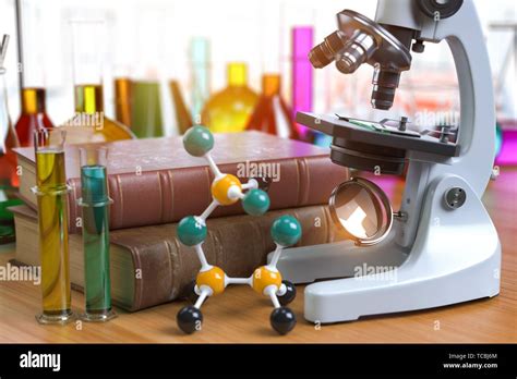 Microscope With Alboratory Equipmente Flasks And Vials Chemistry