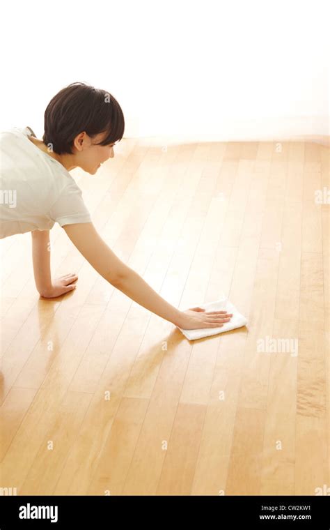 Woman Cleaning Hardwood Floor With A Rag Stock Photo Alamy