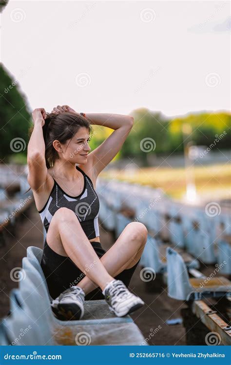 Sporty Girl Outside Concept Of Workout Wellness On Stadium Stock