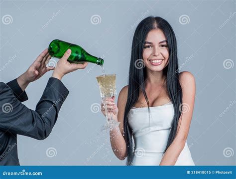 Glamour Woman Having Fun Drinking Alcohol Man Pouring Champagne In Glass Of Woman Stock Image