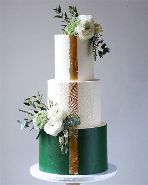 Three Tier Wedding Cake In Forest Green And White With Gold Leaf Art