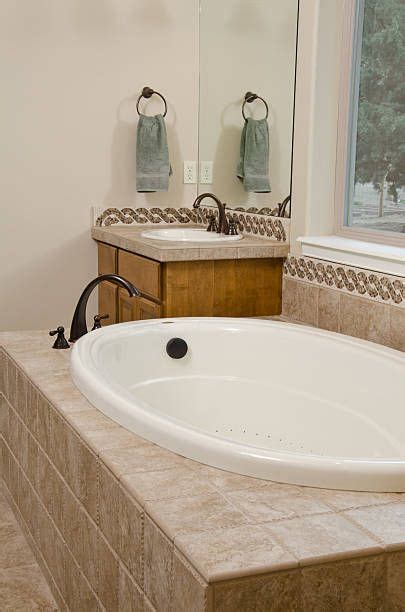 The average cost to install a bathtub is $4,176, but can range from $1,392 and $7,002, depending on the type of tub. Image result for tiling a sunken bath | Sunken bath ...