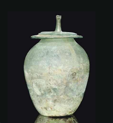 A Roman Green Glass Cinerary Urn Circa 1st 2nd Century A D Free Blown With Ovoid Body Concave