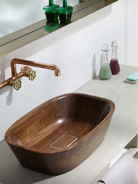 This particular wooden basin made in stone rain wood blends into the warm environment with its. Wonderful Wooden Sinks For A Warm Look Of Your Bathroom