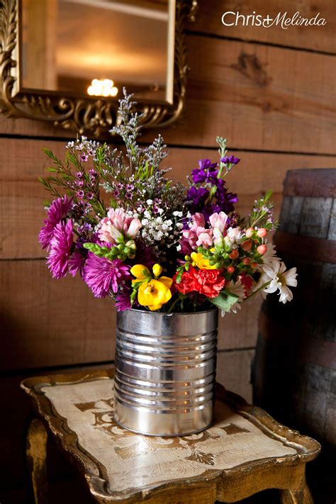 For any rustic themed wedding, wood plays a dominant part in styling up the decor of rustic table settings. Loving something like this for the coffee table... But on ...