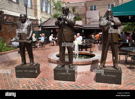 USA, Louisiana, New Orleans. Three jazz legends in bronze at entrance