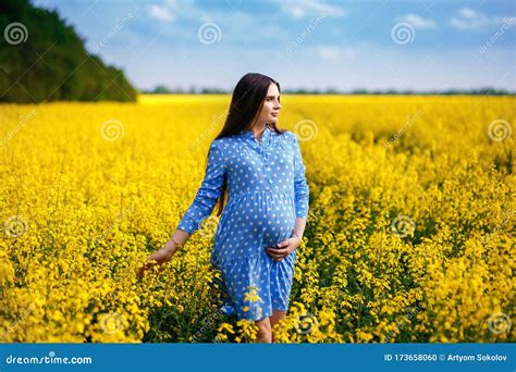 Beautiful Pregnant Girl Walking On A Field Stylish Expectant Mother In