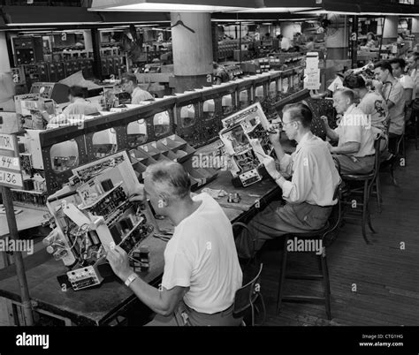 1950s Men In Electronics Factory Working On Television Assembly Line