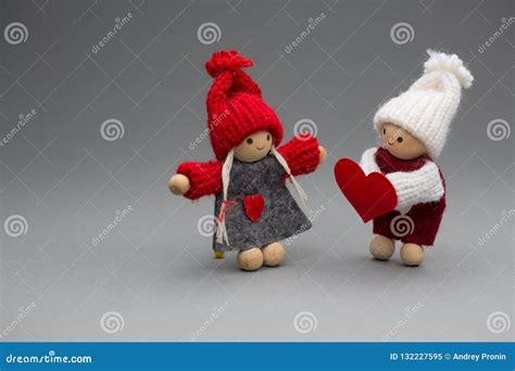 Two Dolls In Love On Valentines Day Knitted Wear With Heart Stock Image