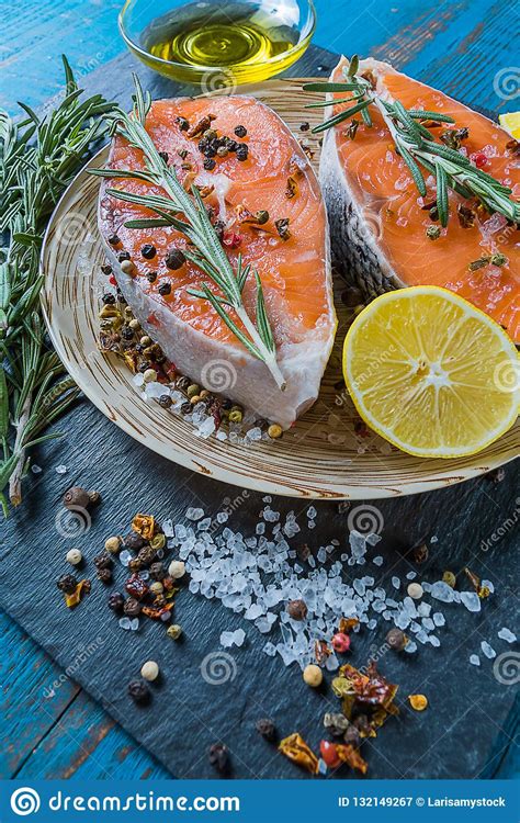 Since clove oil will sit on top of the water you want it dispersed through out. Salmon Fish On A Plate With Spices, Olive Oil And Lemon ...