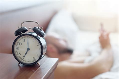 Premium Photo Focus On The Alarm Clock Man Wakes Up Early In The