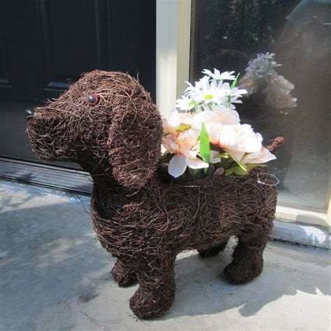 As every topiary is hand made, all. This dog topiary planter is made of a wire frame, covered ...