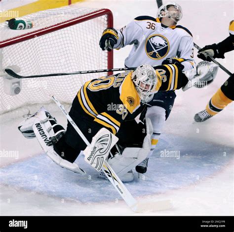 Boston Bruins Goalie Tim Thomas Left Checks Buffalo Sabres Right Wing
