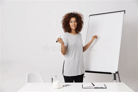 African Businesswoman Smiling Standing Near Marker Whiteboard In Office