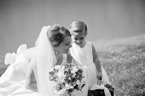adorable shot of the bride and her flowergirl flower girl bride party fashion