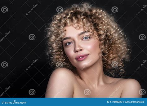 Cute Caucasian Woman With Afro Curls Hairstyle On A Dark Background