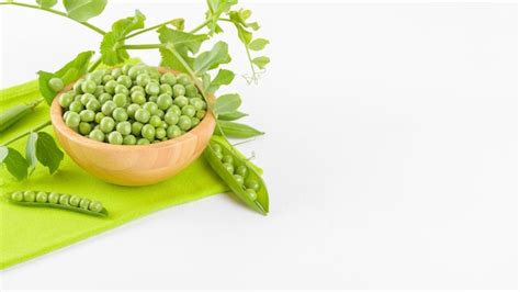 Premium Photo Fresh Green Peas In A Wooden Bowl With Peas Plants