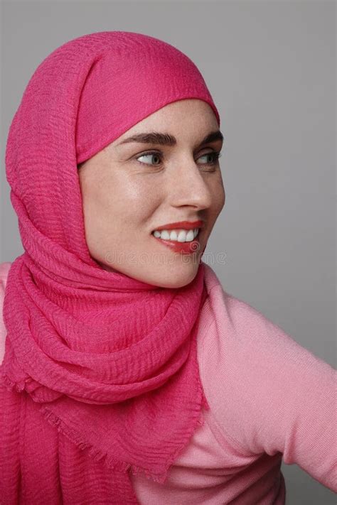 Vertical Close Up Portrait Of A Muslim Young Woman Wearing A Head Scarf