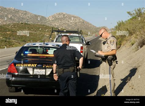 A Local Police Officer Assists A California Highway Patrol Officer On