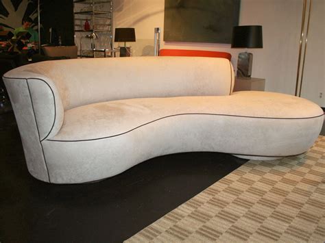 Beautifully crafted unique shape sofa available at extremely low prices. Unique Kidney-Shaped Sofa at 1stdibs