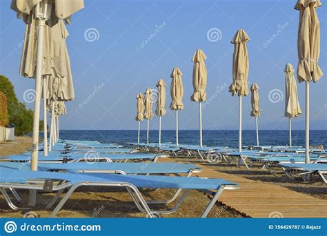 Folded Umbrellas On The Beach Stock Image Image Of Water Umbrellas