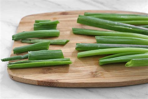 Learn how to chop green onions easily with this step by step tutorial, also you will find out the difference between a scallion and green onion. How to Cut Green Onions (Scallions) | Clean Green Simple