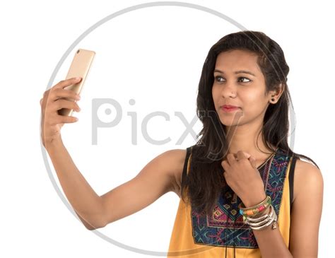 Image Of Young Indian Girl Taking Selfie With Mobile Or Smartphone On