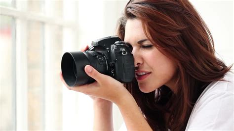 Beautiful Young Female Photographer Taking Pictures , Puts The Focus ...