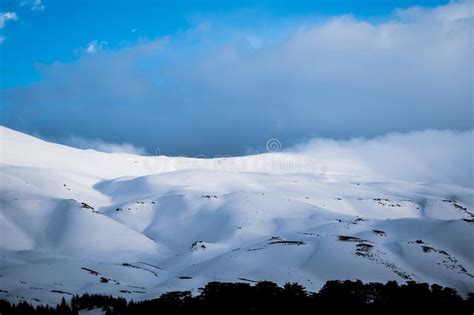 Beautiful Capture Of A Mountain Covered With Snow Stock Photo Image